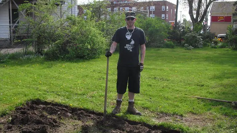 Digging Up The Soil To Remove The Grass
